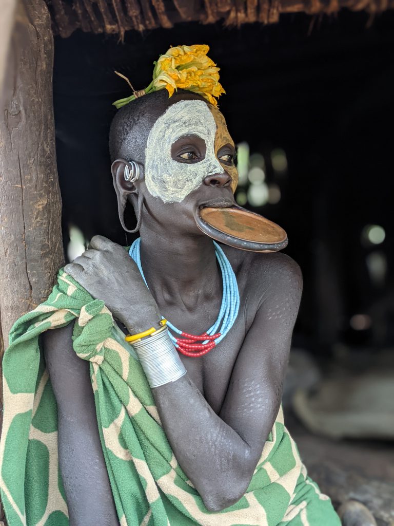 welcome to omo valley , a girl from omo valley in traditional clothing