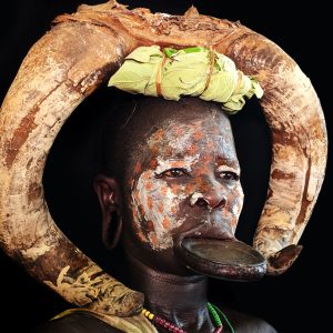 suri/ surma tribes with decorative lip palete and cow horn